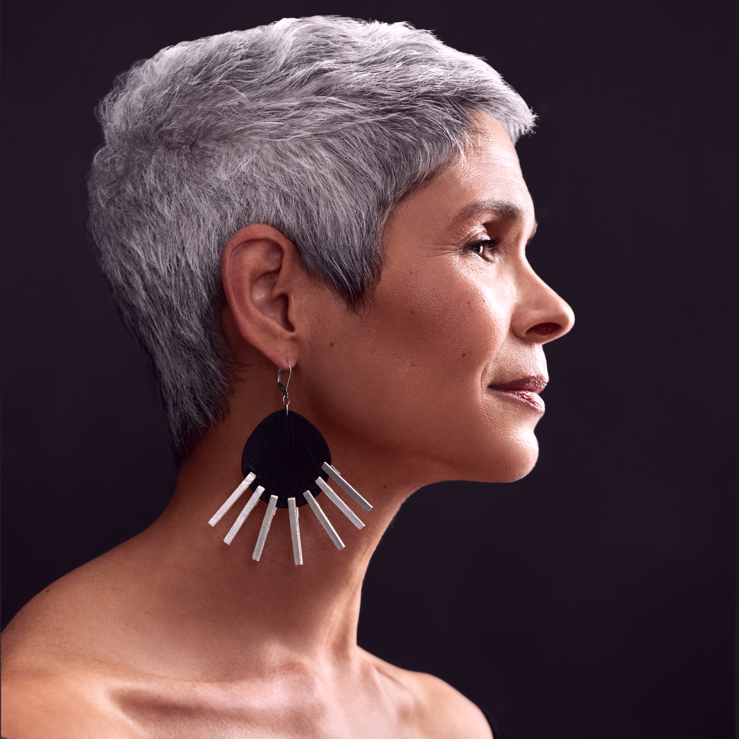 Silver haired model in profile with scalp beautifully covered using Border Line