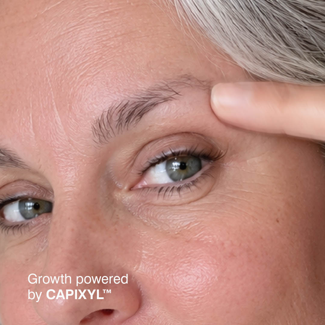 Applying Root Rouser eyebrow growth serum to clean brows at night.