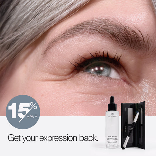 Woman with naturally silver hair wearing True Expression brow powder beside the Big Expression brow growth serum and powder set. 