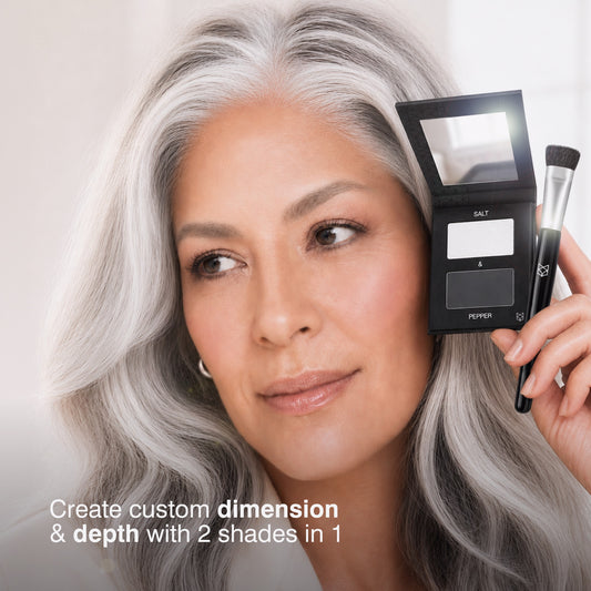 Woman with silver hair holding Border Line Doubles Salt & Pepper two-shade optical hair filler compact and brush for custom dimension and depth